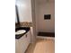 Bathroom with a white sink vanity, mosaic tile backsplash, and a shower stall with black and white tiles at 1603 Emily Ct, Kissimmee, FL 34744
