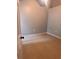 Neutral bedroom with tile flooring, gray walls, and a door to the side at 1603 Emily Ct, Kissimmee, FL 34744