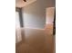 Bedroom featuring tile flooring, light gray walls, and an adjacent room at 1603 Emily Ct, Kissimmee, FL 34744