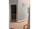Neutral hallway with tiled floor, and a door to a modern bathroom at 1603 Emily Ct, Kissimmee, FL 34744