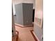 Neutral hallway with tiled floor, modern wall fixtures and easy access to different rooms at 1603 Emily Ct, Kissimmee, FL 34744