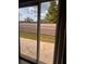 View of private patio through glass doors, perfect for outdoor living at 1603 Emily Ct, Kissimmee, FL 34744