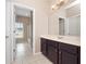 Bathroom vanity with tile flooring and a view into a separate bathroom area at 1610 Mohegan Blvd, Kissimmee, FL 34744