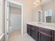 Bright bathroom vanity with a view of the bath and shower area at 1610 Mohegan Blvd, Kissimmee, FL 34744
