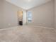 Neutral bedroom featuring a window with blinds and carpeted floors at 1610 Mohegan Blvd, Kissimmee, FL 34744