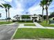 Community clubhouse featuring covered pavilions, mature landscaping, and recreational area at 1610 Mohegan Blvd, Kissimmee, FL 34744