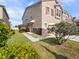 A well-maintained home featuring verdant landscaping and inviting curb appeal on a sunny day at 1610 Mohegan Blvd, Kissimmee, FL 34744