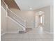 Foyer featuring tile flooring and a staircase leading to the upper level at 1610 Mohegan Blvd, Kissimmee, FL 34744