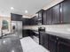 Close up of kitchen offering stainless steel appliances and granite countertops at 1610 Mohegan Blvd, Kissimmee, FL 34744