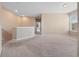 Upper-level loft featuring neutral carpeting, natural light, and open layout at 1610 Mohegan Blvd, Kissimmee, FL 34744