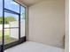 Screened lanai offers an outdoor space with a view of the fenced backyard at 1610 Mohegan Blvd, Kissimmee, FL 34744