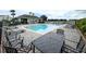 Community pool with a pool house and seating for gatherings at 1610 Mohegan Blvd, Kissimmee, FL 34744