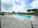Community pool with lounge chairs and a lifeguard ring for safety at 1610 Mohegan Blvd, Kissimmee, FL 34744