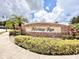The Heritage Run stone community sign surrounded by lush landscaping and palm trees at 1610 Mohegan Blvd, Kissimmee, FL 34744