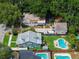 Bird's-eye view of backyard with a swimming pool, spa, shed, patio, and manicured lawn at 1625 S Eola Dr, Orlando, FL 32806