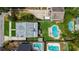 Overhead view shows the pool, lush backyard, storage shed, and patio with lounge furniture at 1625 S Eola Dr, Orlando, FL 32806