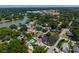 Aerial view of the property shows the lake nearby, mature trees, and community amenities around property at 1625 S Eola Dr, Orlando, FL 32806