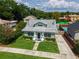Aerial view of the house showcasing its well-manicured lawn and professional landscaping at 1625 S Eola Dr, Orlando, FL 32806
