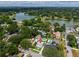 This aerial view shows proximity to a lake, mature trees, and well-maintained landscaping at 1625 S Eola Dr, Orlando, FL 32806