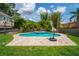 Lush backyard featuring a pool, hot tub, and manicured landscaping at 1625 S Eola Dr, Orlando, FL 32806