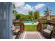 Backyard features a private pool, seating, a wood fence, mature bamboo trees and professional landscaping at 1625 S Eola Dr, Orlando, FL 32806