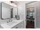 This bathroom has a white vanity with a large framed mirror and modern faucet at 1625 S Eola Dr, Orlando, FL 32806