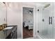 This bathroom with a shower is viewed from the door to the bedroom at 1625 S Eola Dr, Orlando, FL 32806
