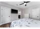This bedroom features hardwood floors, modern ceiling fan, and flat screen TV at 1625 S Eola Dr, Orlando, FL 32806