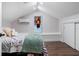 Bedroom with hardwood flooring and an air conditioner providing comfort and style at 1625 S Eola Dr, Orlando, FL 32806