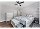 This is a cozy bedroom with hardwood floors, ceiling fan, white trim and chest of drawers at 1625 S Eola Dr, Orlando, FL 32806