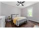 This bedroom has a queen bed, bedside tables, and window with natural light at 1625 S Eola Dr, Orlando, FL 32806