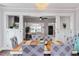 Bright dining room featuring hardwood flooring, decorative chandelier, and storage cabinets at 1625 S Eola Dr, Orlando, FL 32806