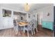 Dining room featuring decorative chandelier, hardwood flooring, and bright open plan at 1625 S Eola Dr, Orlando, FL 32806