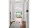 Hallway view leading to a naturally lit room with hardwood floors and neutral tones at 1625 S Eola Dr, Orlando, FL 32806