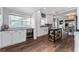 Kitchen featuring white cabinetry, stainless appliances, and a beverage cooler near the dining room at 1625 S Eola Dr, Orlando, FL 32806