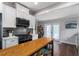 Kitchen featuring stainless appliances, an island, bright white cabinets, and backyard access at 1625 S Eola Dr, Orlando, FL 32806