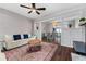 Open-concept living room with hardwood floors, an area rug, and easy access to the dining area at 1625 S Eola Dr, Orlando, FL 32806