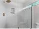 This shower is bright and clean with white subway tile and a glass enclosure at 1625 S Eola Dr, Orlando, FL 32806