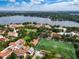 Stunning aerial view of a prestigious college campus along a lake with lush landscaping at 1821 Windsor Dr, Winter Park, FL 32789
