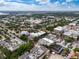 Expansive aerial view of the city showcasing the many buildings and structures in the area, under a bright blue cloudy sky at 1821 Windsor Dr, Winter Park, FL 32789