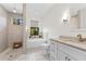 Bathroom boasting a soaking tub and luxurious walk-in shower with pebble floor and bench at 1821 Windsor Dr, Winter Park, FL 32789