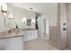 Spacious bathroom featuring double vanities, a walk-in shower and a closet at 1821 Windsor Dr, Winter Park, FL 32789