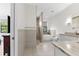 Bright bathroom featuring double vanities, a soaking tub, and a separate shower at 1821 Windsor Dr, Winter Park, FL 32789