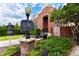 Exterior view of the brick Winter Park Historical Museum with a historical marker, benches, manicured landscaping, and blue skies at 1821 Windsor Dr, Winter Park, FL 32789