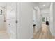 Hallway featuring white doors and wood floors leading to a bedroom and bathroom at 1821 Windsor Dr, Winter Park, FL 32789