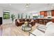 Inviting living space with an open concept design, wood floors, stylish seating, and easy access to the outdoors at 1821 Windsor Dr, Winter Park, FL 32789