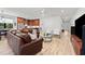 Spacious living room featuring an open concept design, wood floors, and stylish furnishings with abundant natural light at 1821 Windsor Dr, Winter Park, FL 32789