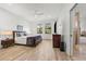 Bright main bedroom features a ceiling fan, wood flooring, modern decor and ensuite bathroom at 1821 Windsor Dr, Winter Park, FL 32789