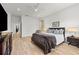 Bright main bedroom features a ceiling fan, wood flooring, walk-in closet, and ensuite bathroom at 1821 Windsor Dr, Winter Park, FL 32789