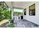 This outdoor kitchen offers stainless steel appliances and a beautiful stone patio at 1821 Windsor Dr, Winter Park, FL 32789
